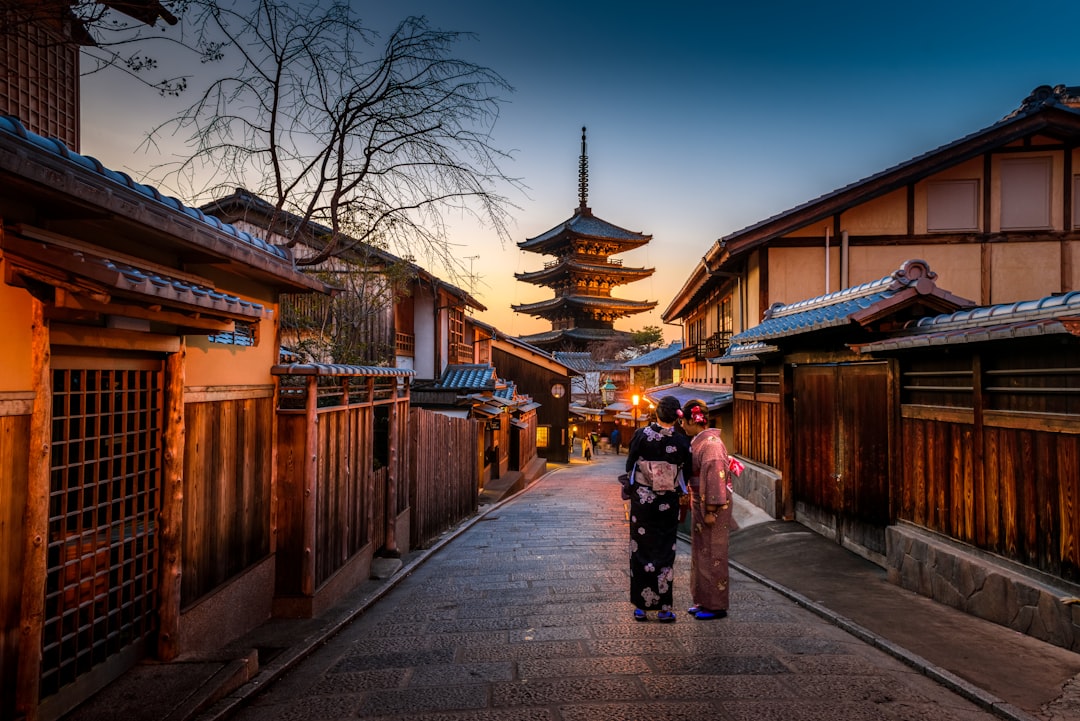 Things to Do in Kyoto cover image with temple roofs, lanterns, and a sunset walking route