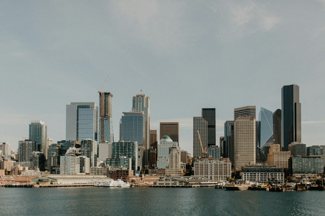 Seattle travel nurse itinerary cover showing the Seattle skyline, ferries on Elliott Bay, and a shift-friendly planner layout
